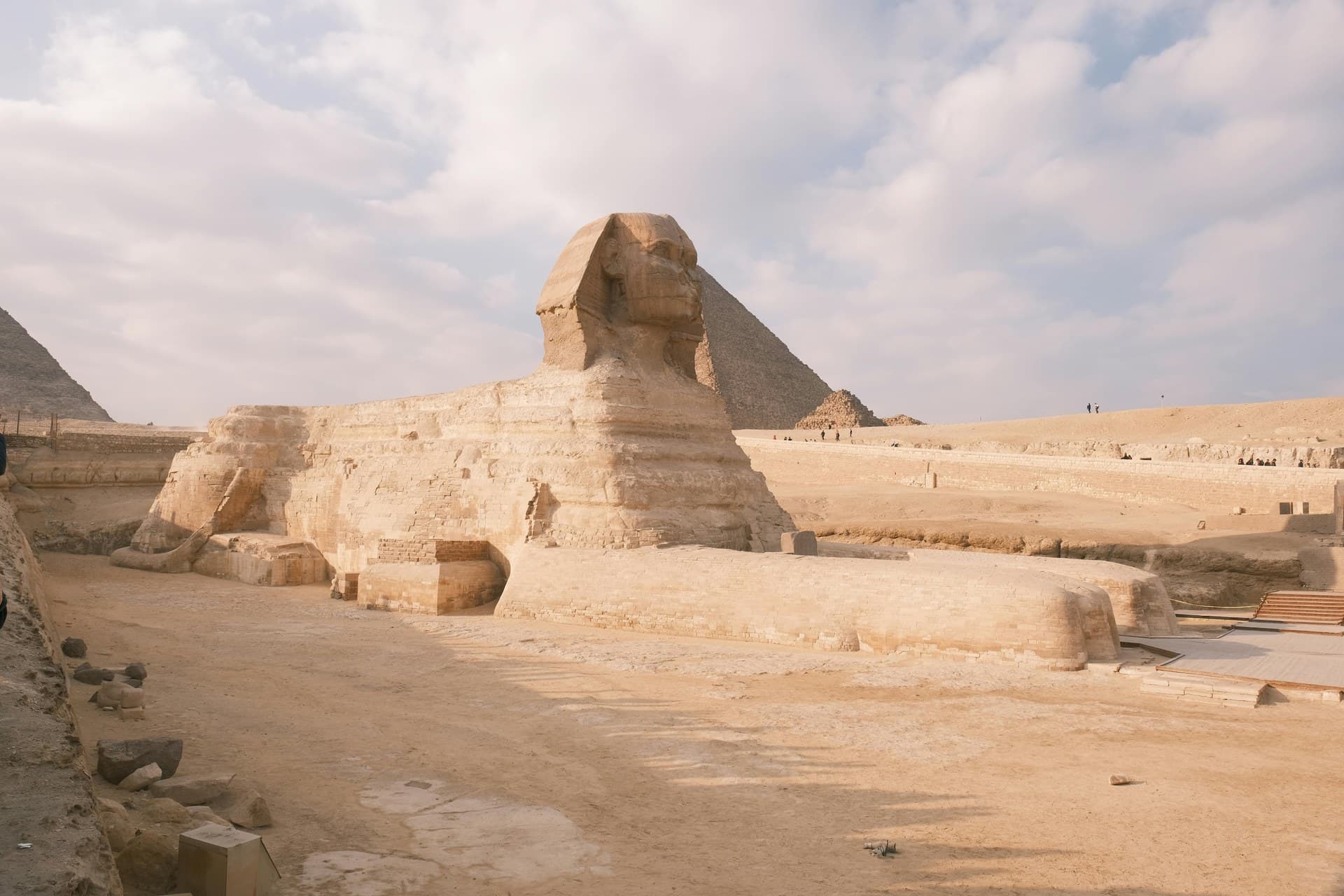 The Great Sphinx of Giza seen from the side with the pyramid of Khafre rising behind it