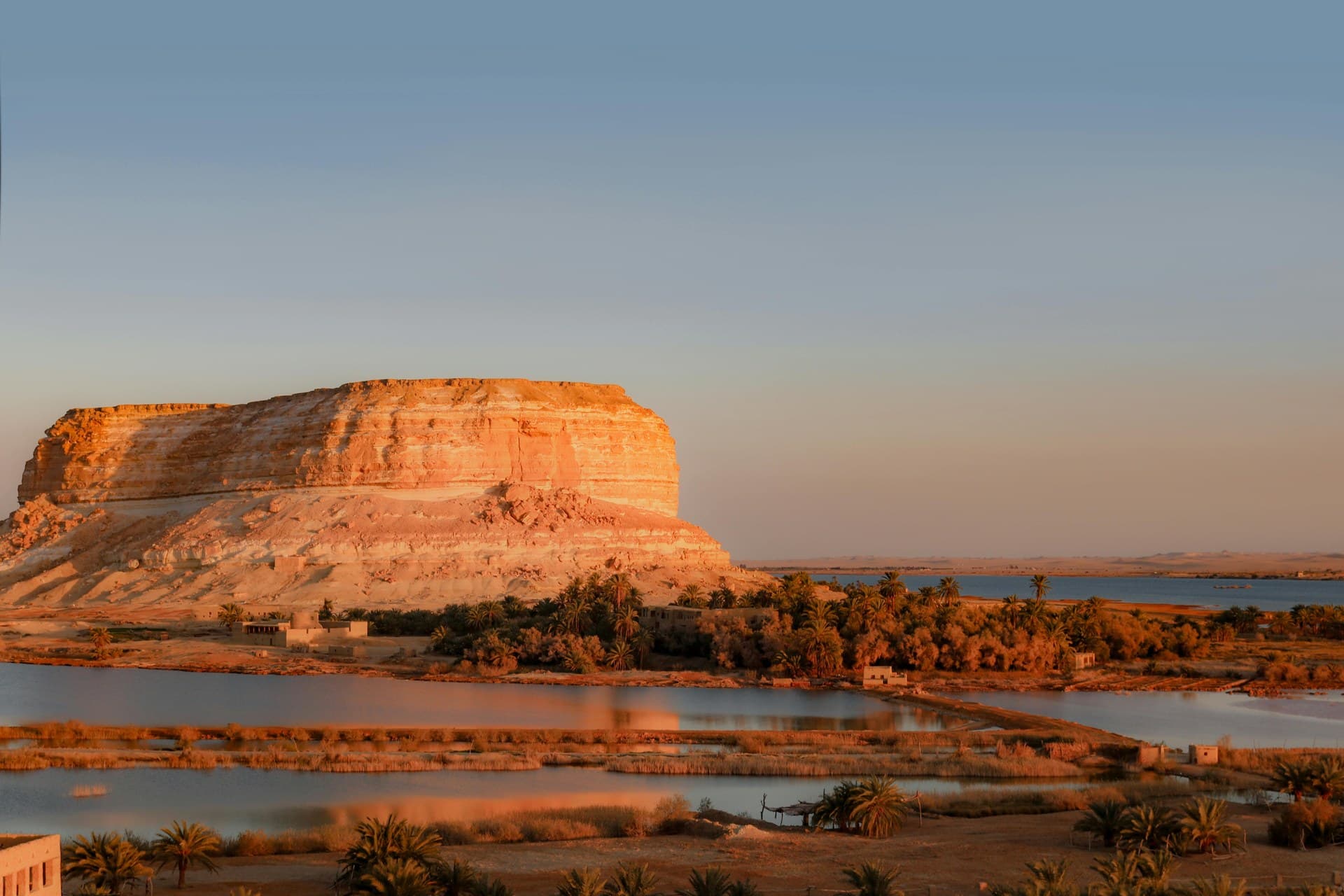 Date palms and salt lakes around the mud-brick ruins of Shali fortress at Siwa Oasis