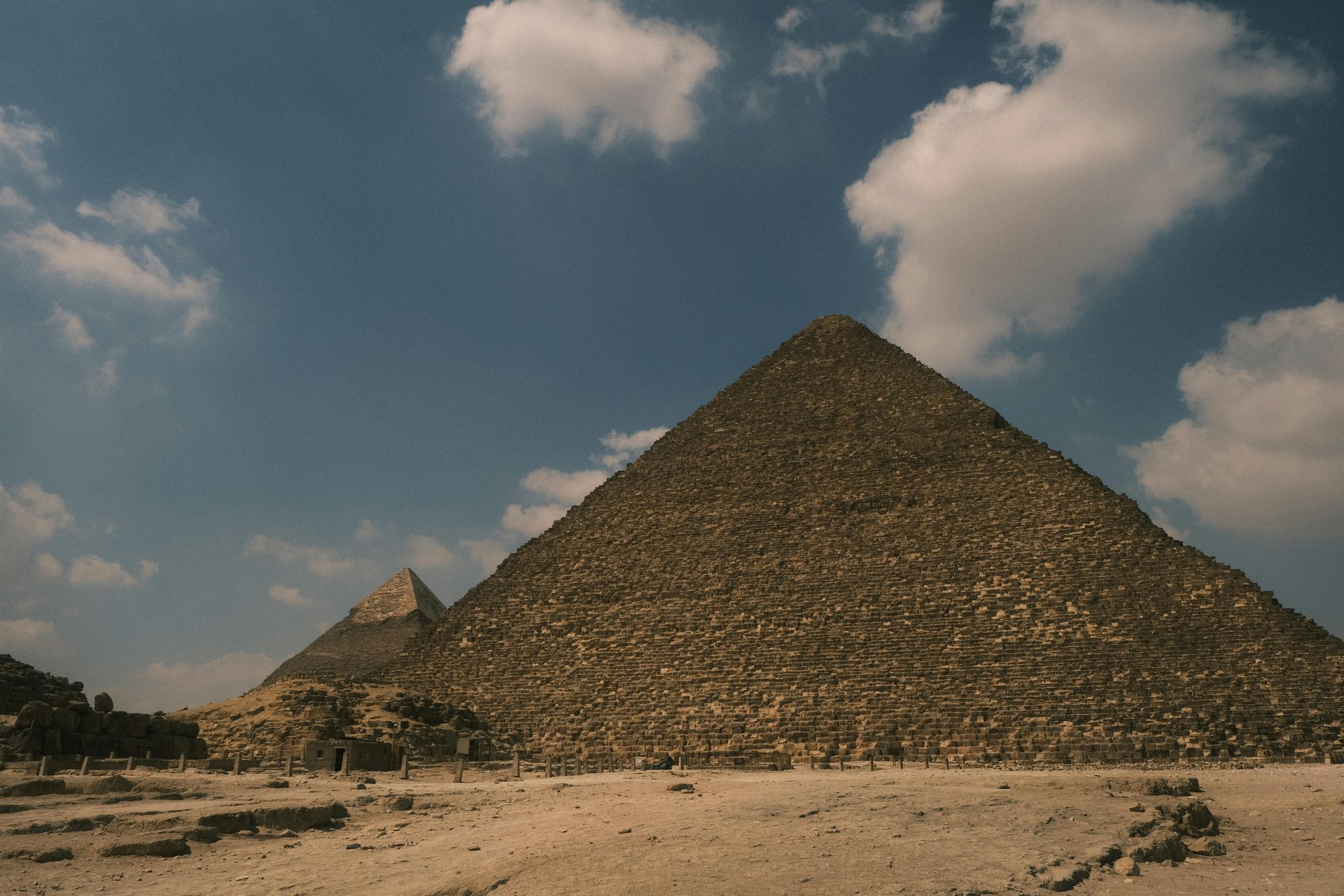A wide view across the Giza plateau with all three pyramids in line
